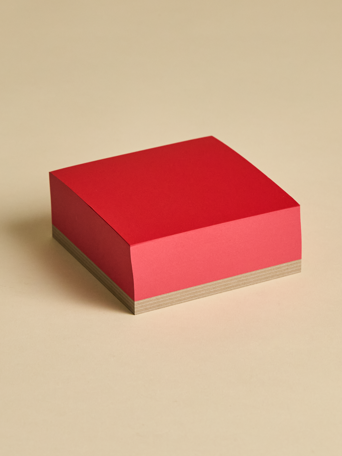 Red memoblock sitting on light background