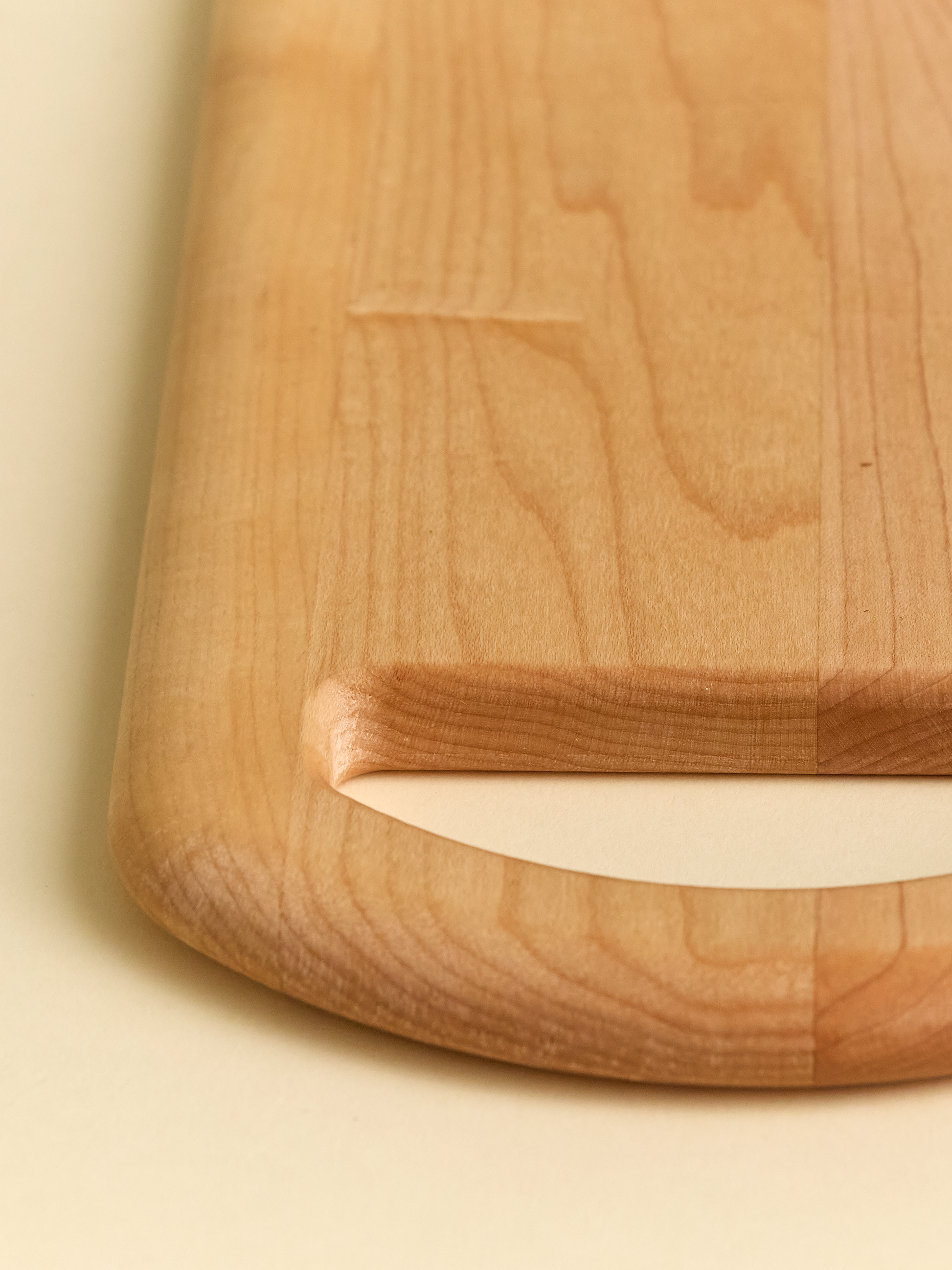 Close up of handle on domecíl Maple Cutting Board