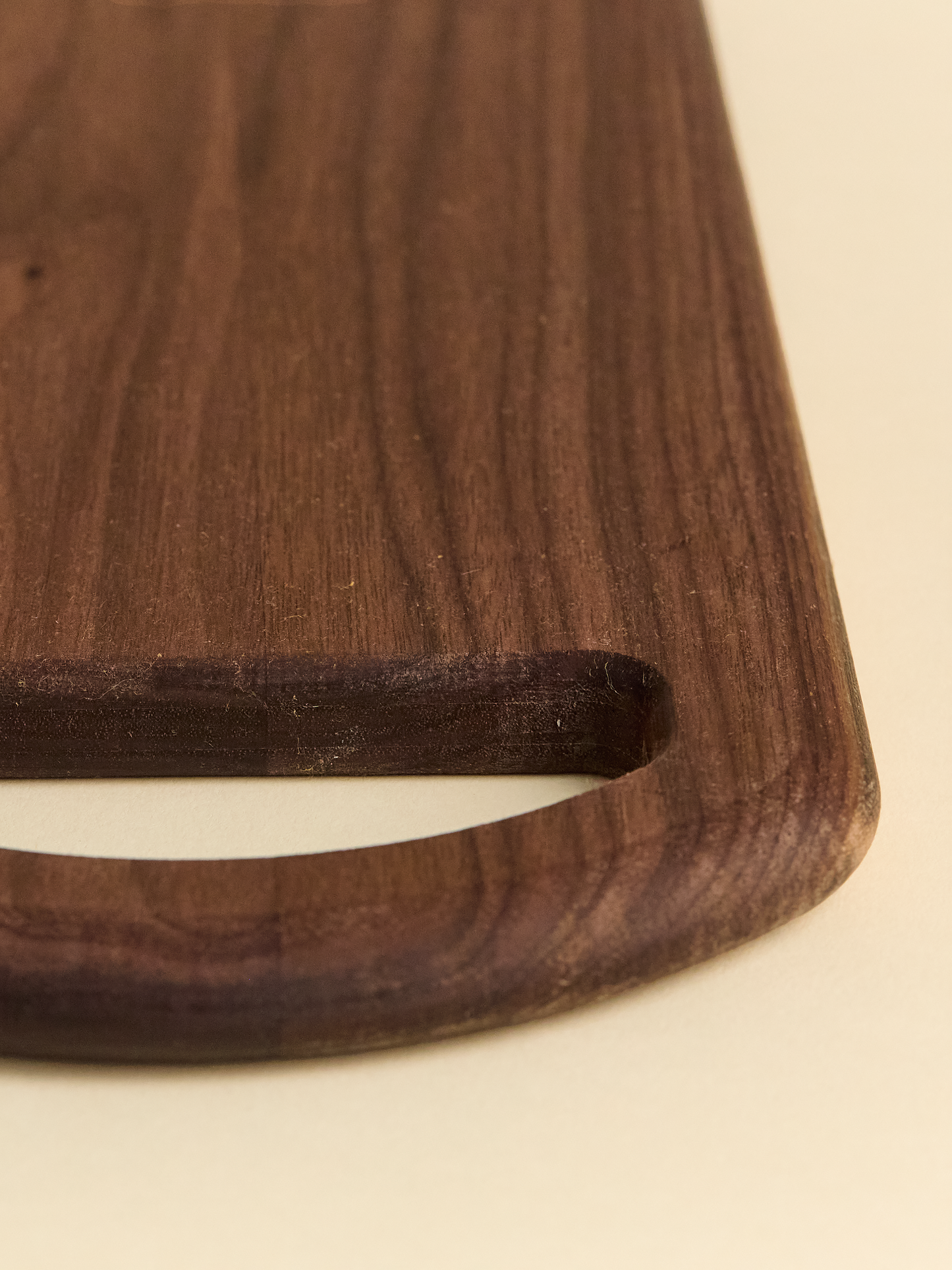 Close up of domecíl Walnut Cutting Board handle