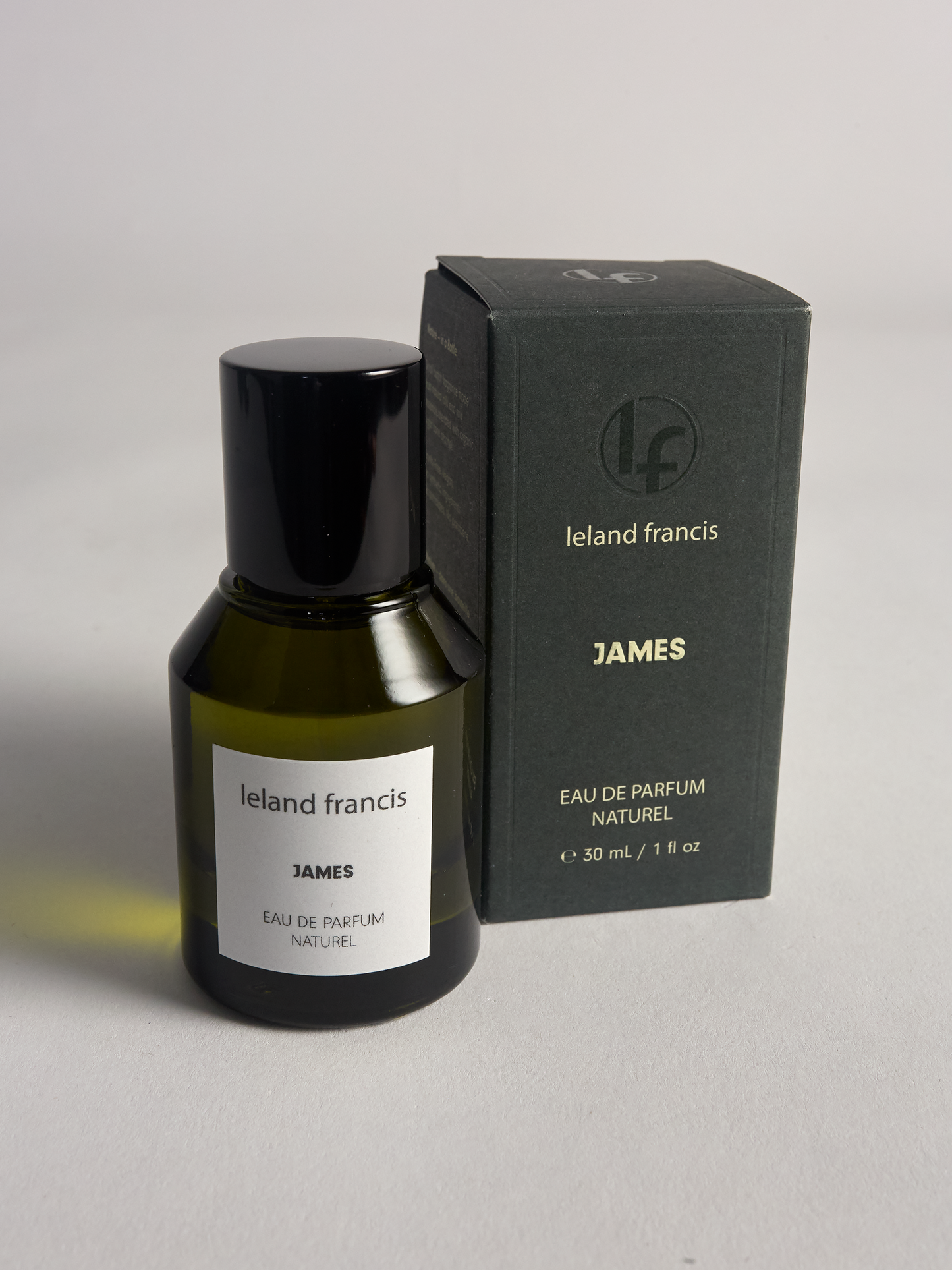 Ieland Francis James perfume bottle and packaging on a gray background
