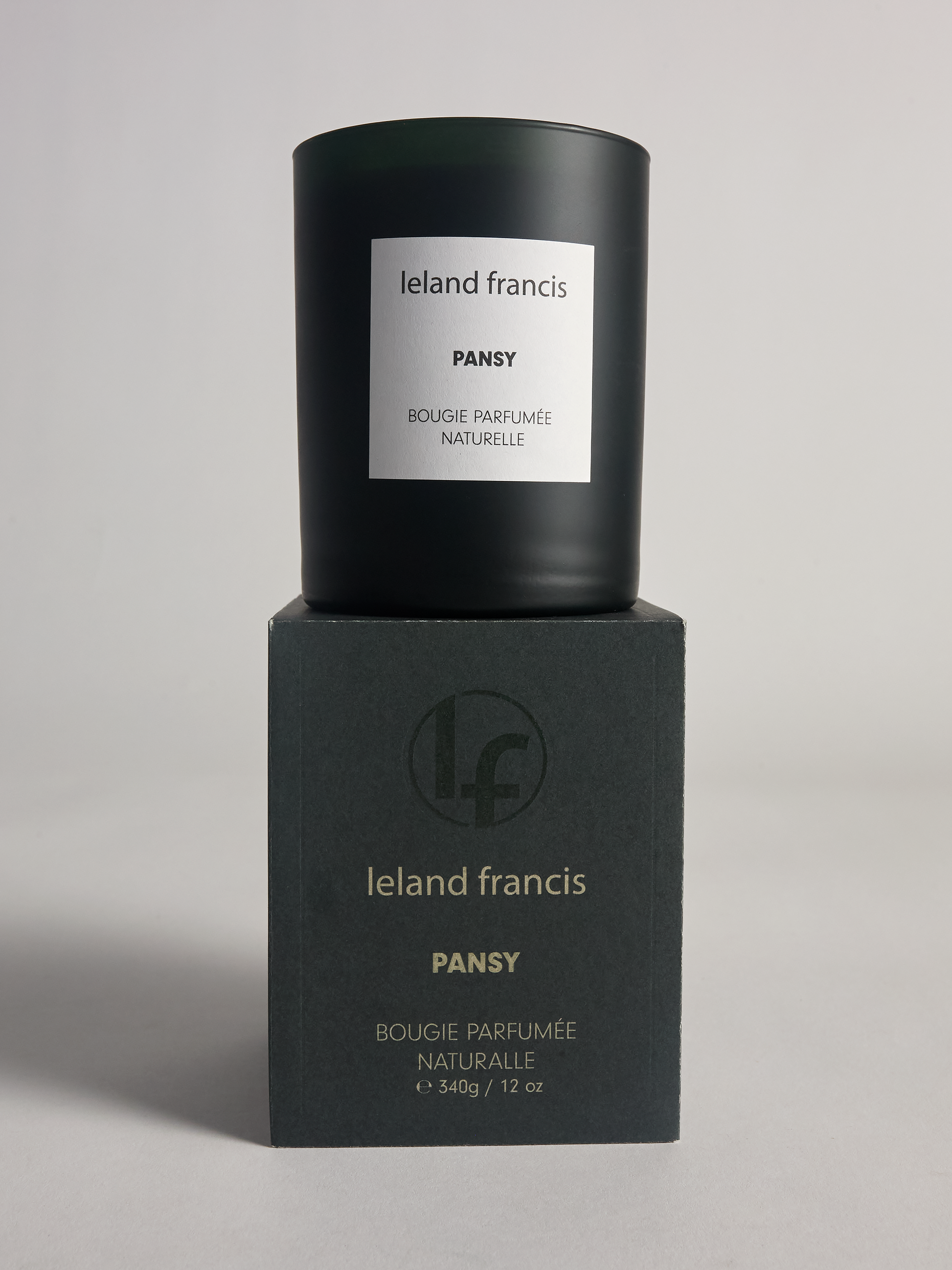 Ieland Francis Pansy candle and packaging on a gray background