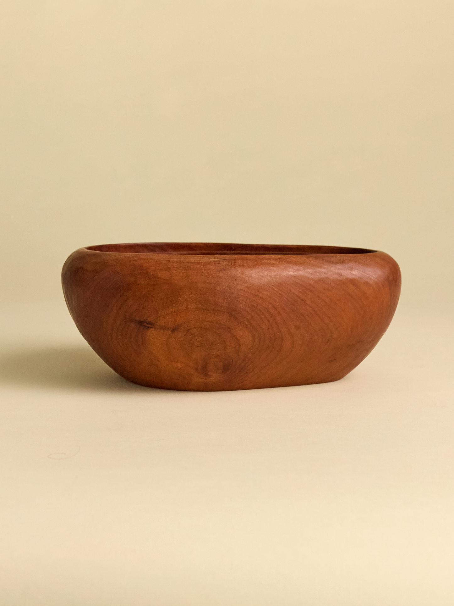 Side view of largest Hand Carved Rauli Nesting Bowl