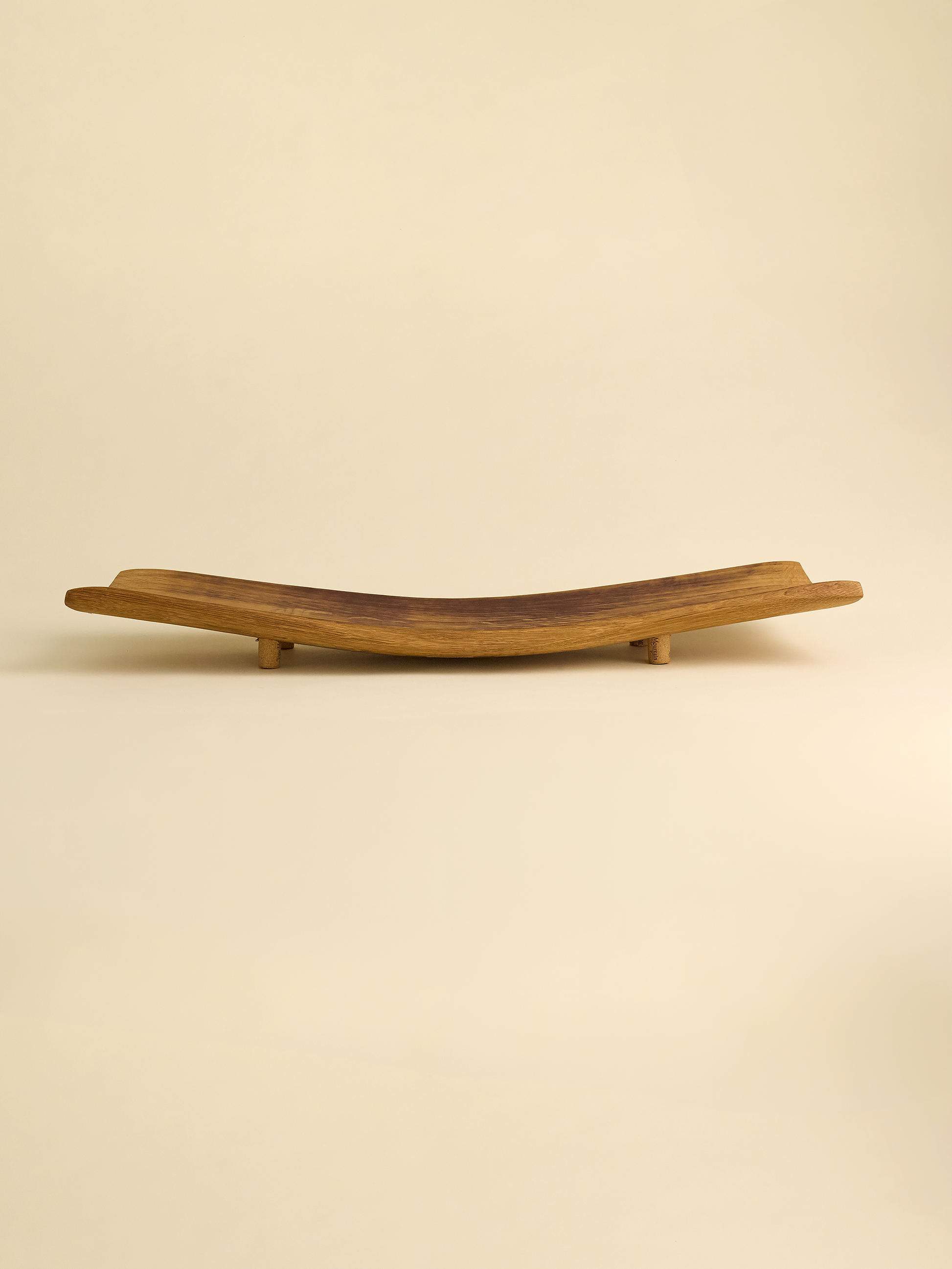 French Oak Barrel Platter on neutral background with four cork feet