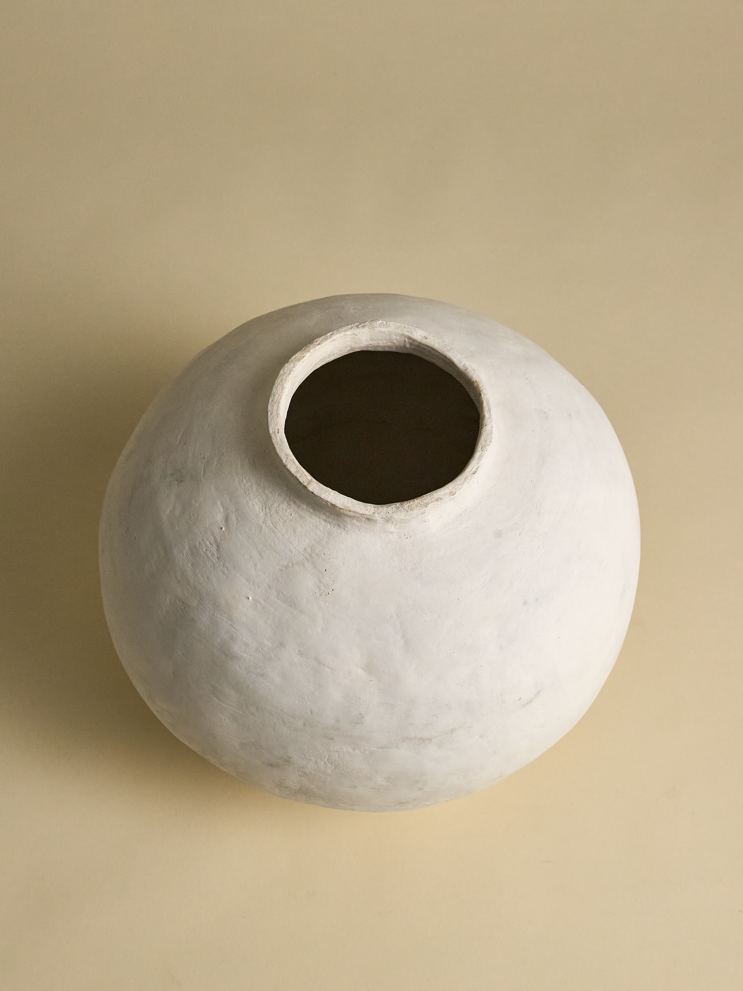 Top full view of Pascale Vaquette Cotton Pomegranate Vase on light tan background