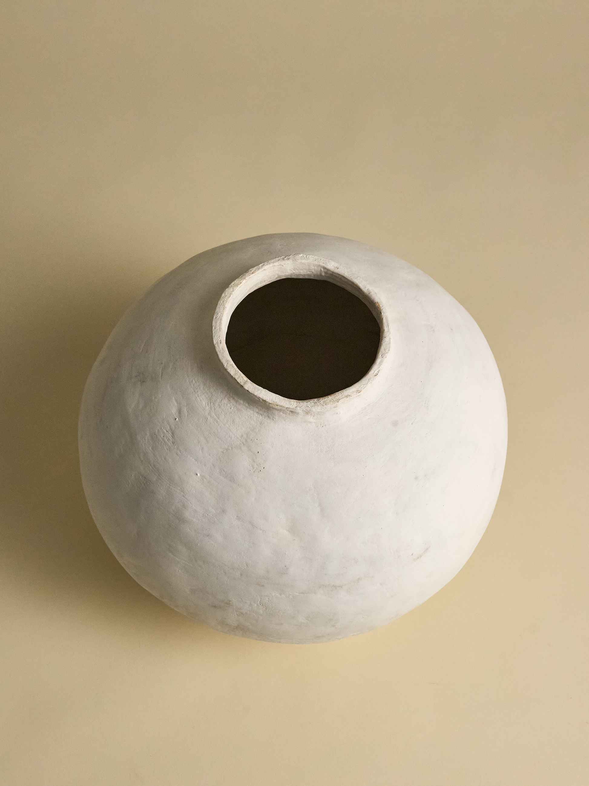 Top full view of Pascale Vaquette Cotton Pomegranate Vase on light tan background