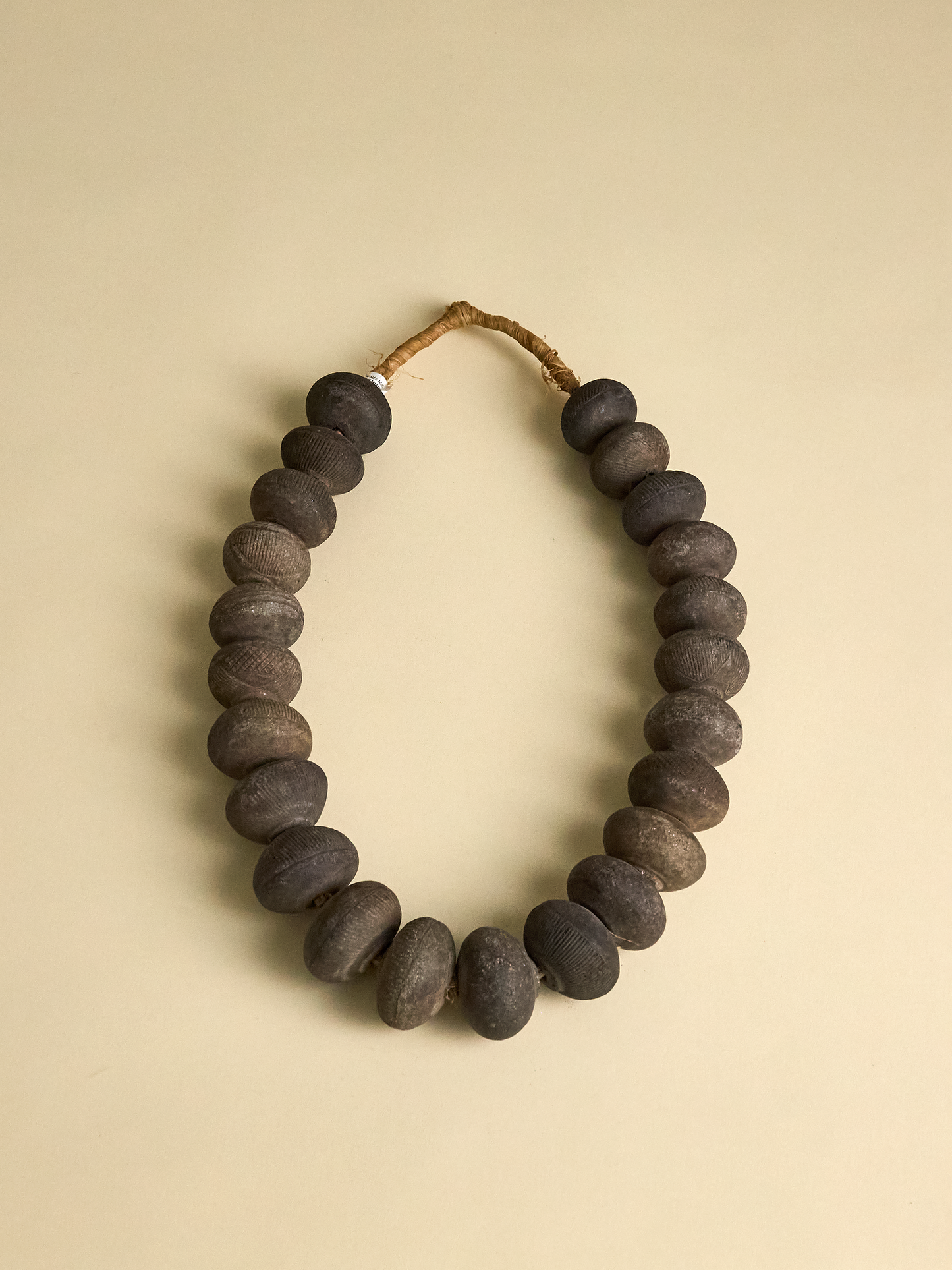 Vintage Clay Beads from Nigeria photographed on light background