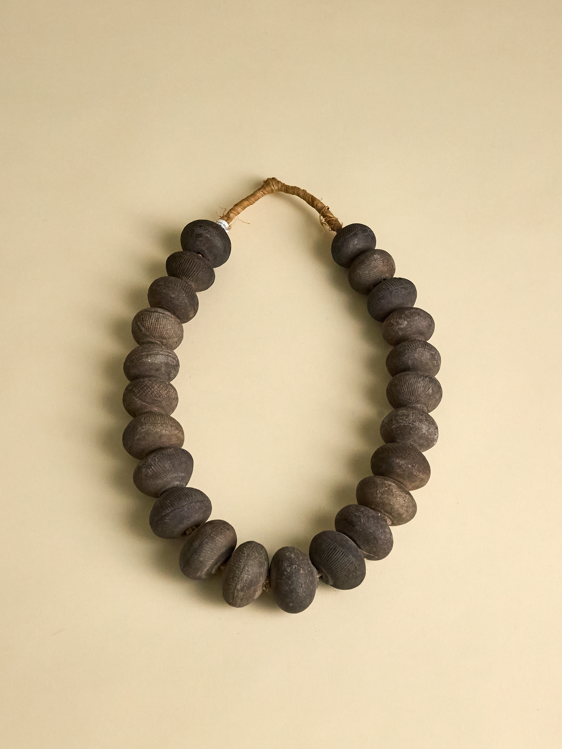 Vintage Clay Beads from Nigeria photographed on light background