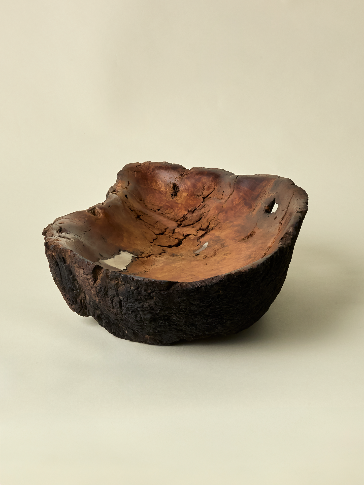 Other view of Gabaldón Burl Alloy Bowl on light background with view of raw exterior