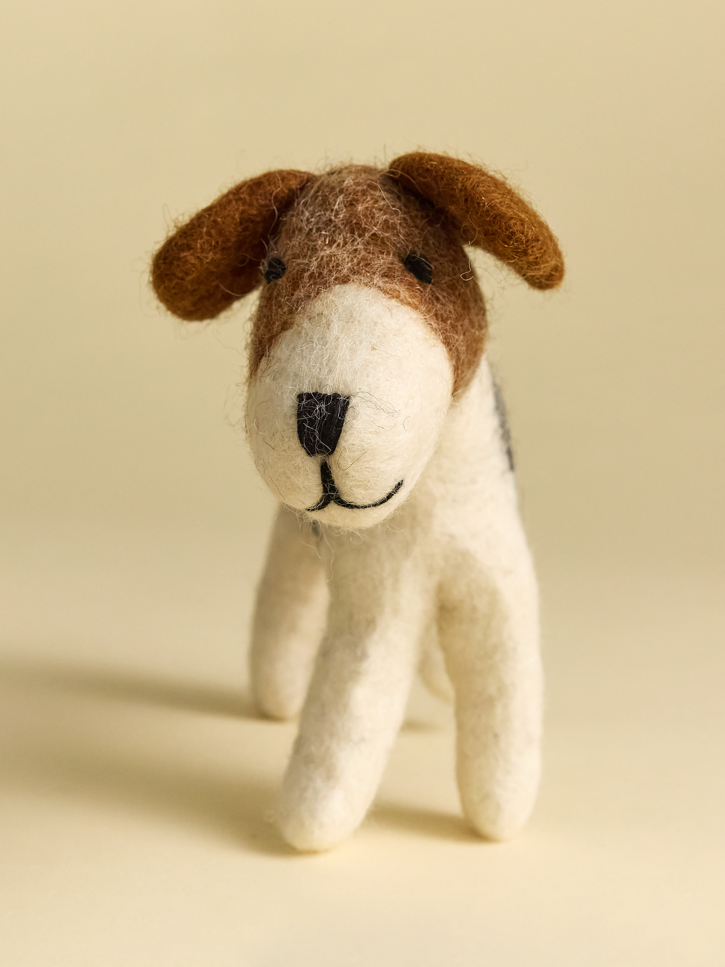Happy small felt dog