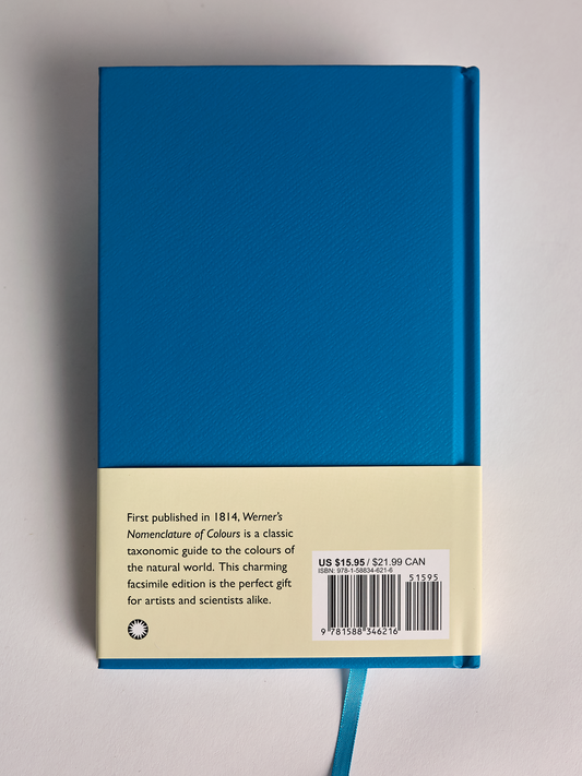 Blue book titled 'Werner's Nomenclature of Colours' back cover on a gray background