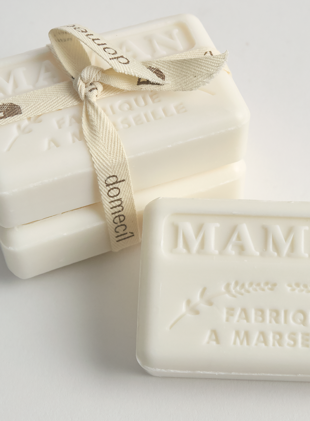 Two bars of MANAN soap bundled with 'damecil' branding on a light background