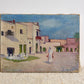 Vintage French Pink Houses Landscape Painting on white background with fabric underneath 