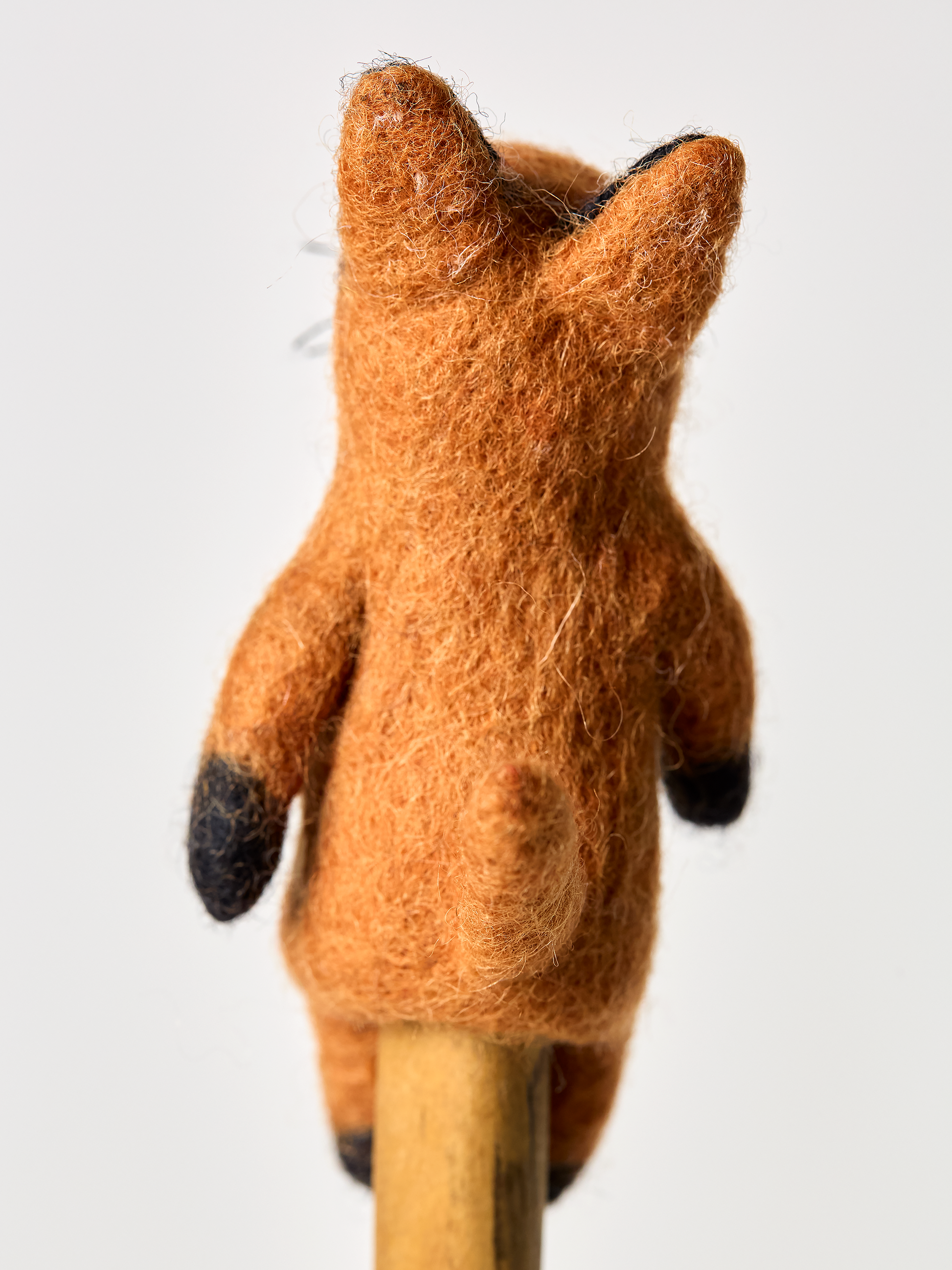 Red fox finger puppet toy backside angel on a white background