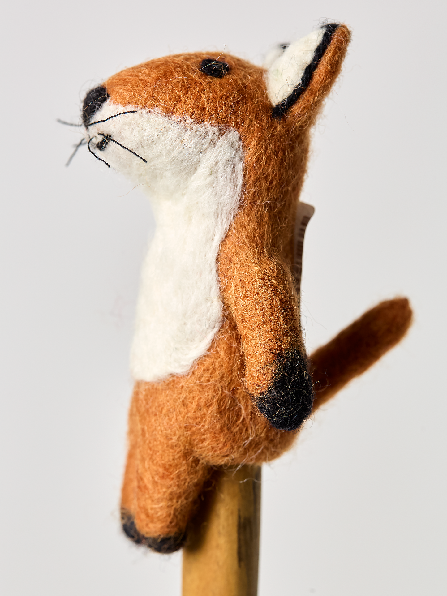 Red fox finger puppet toyside angel on a white background