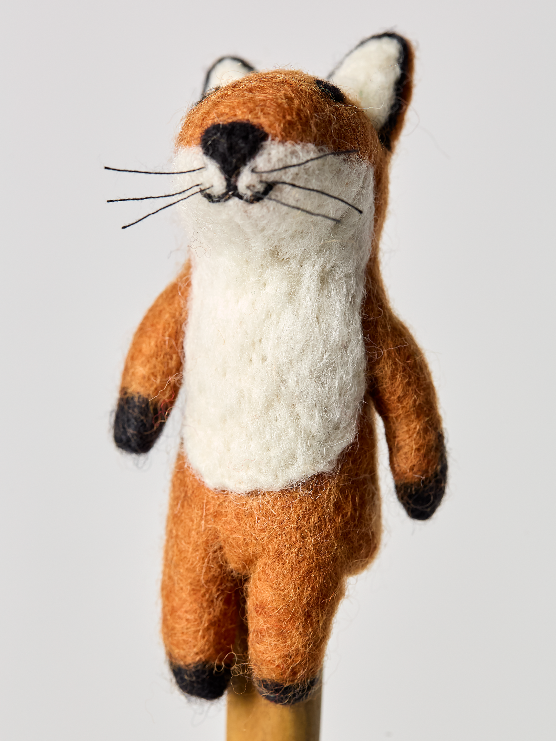 Red fox finger puppet toy on a white background