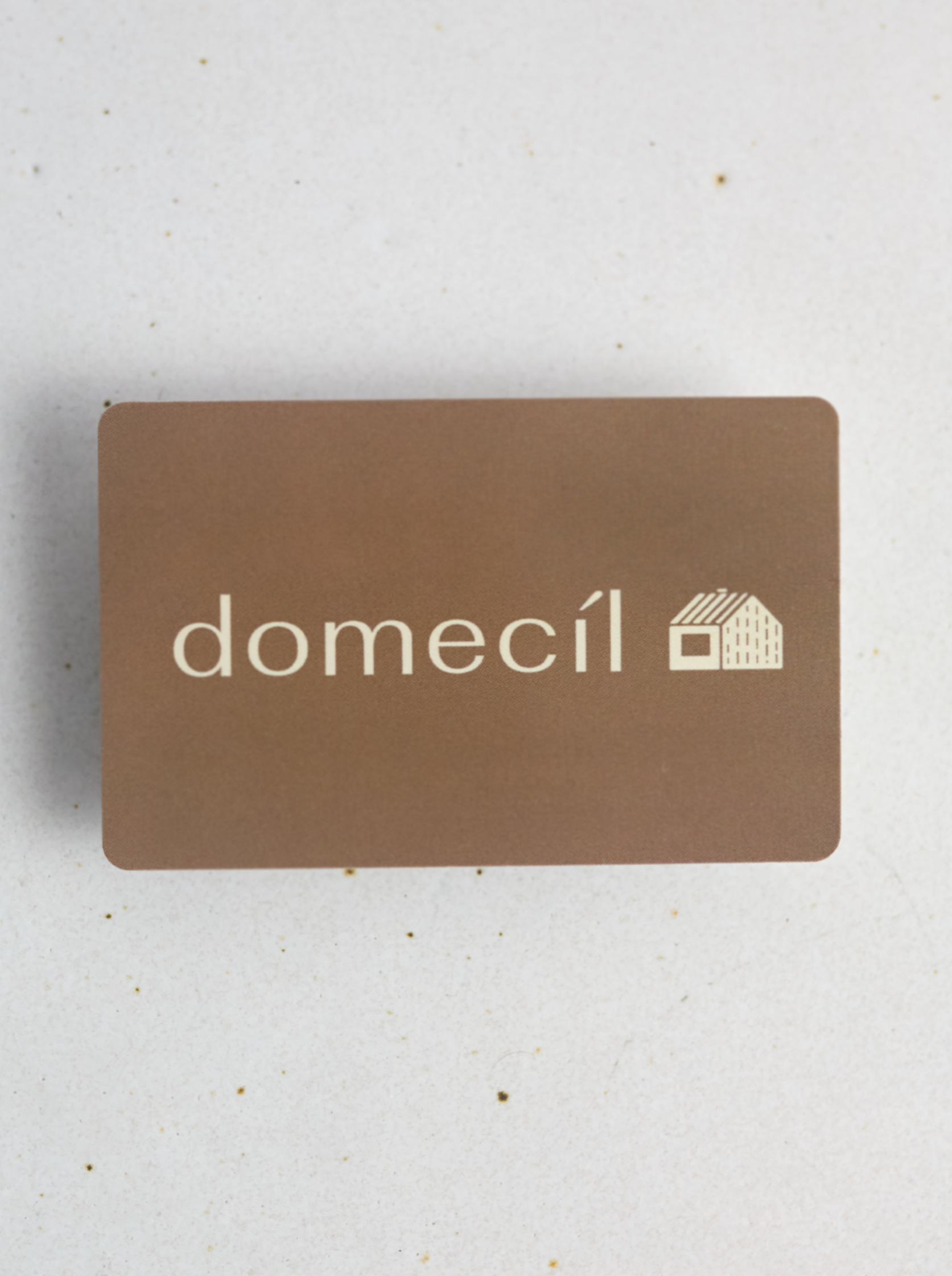 Brown  gift card with 'domecil' logo on a light gray background