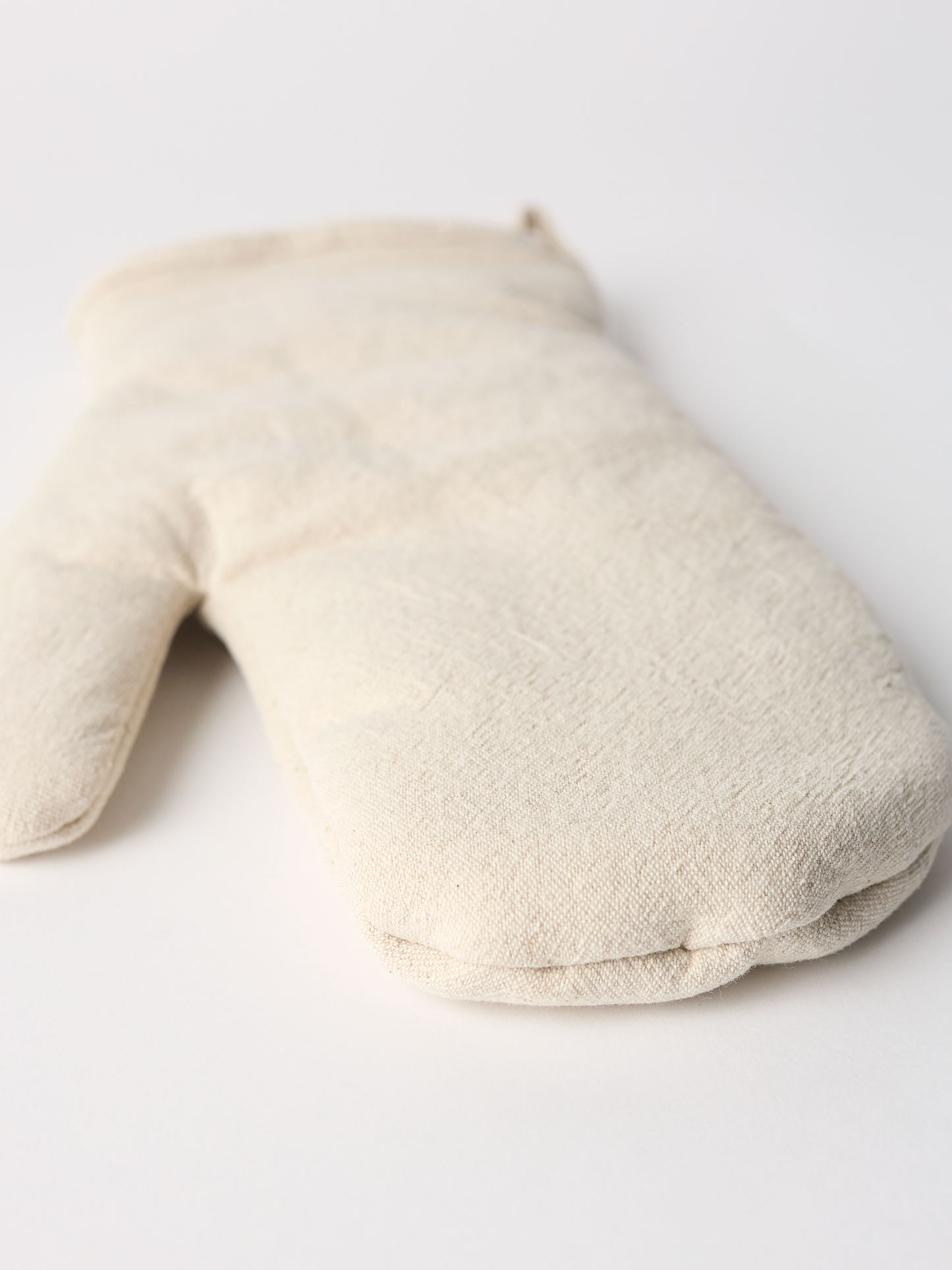 Beige neck pillow on a white background