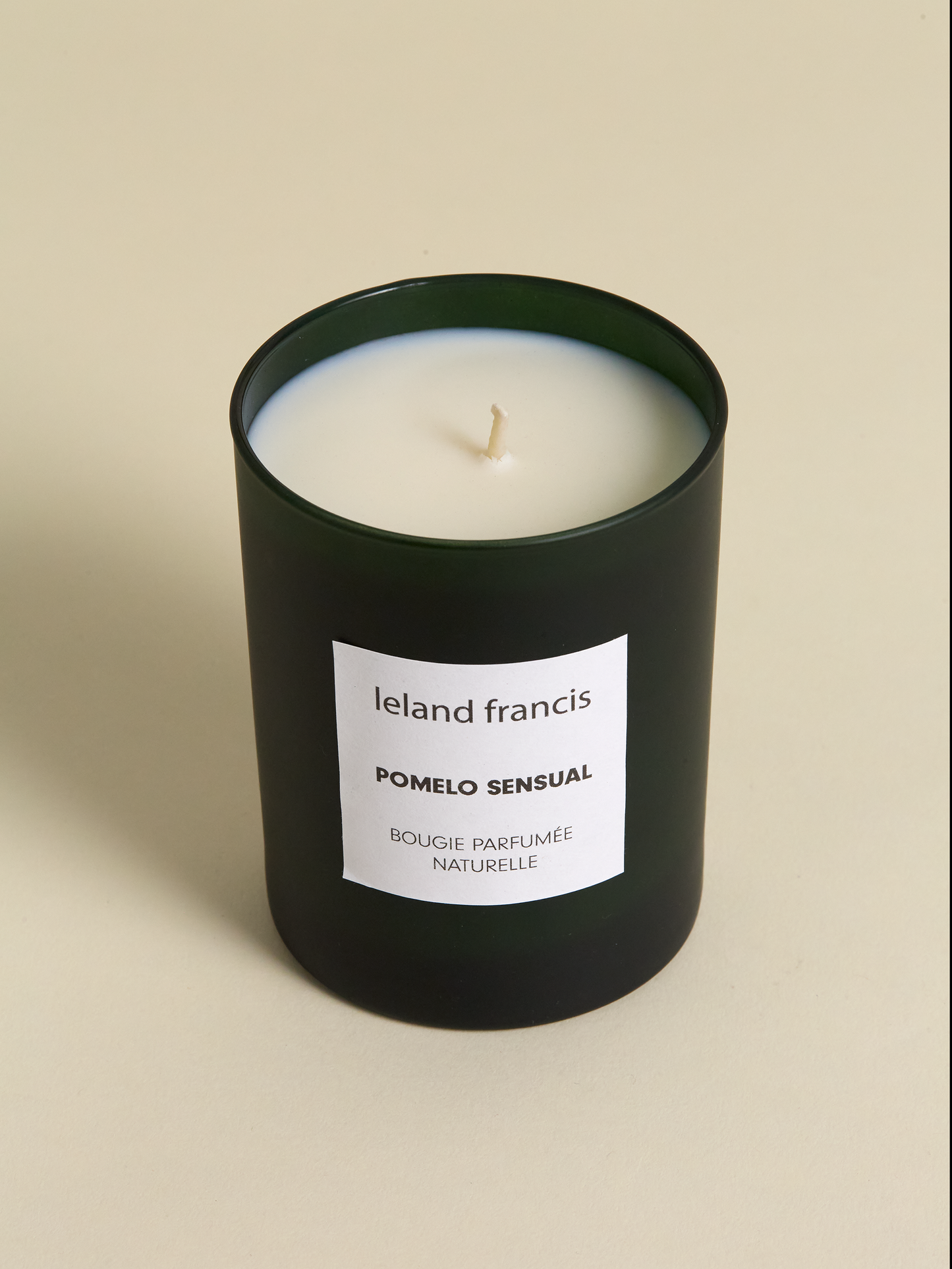 Leland Francis Pomelo candle on light background from above