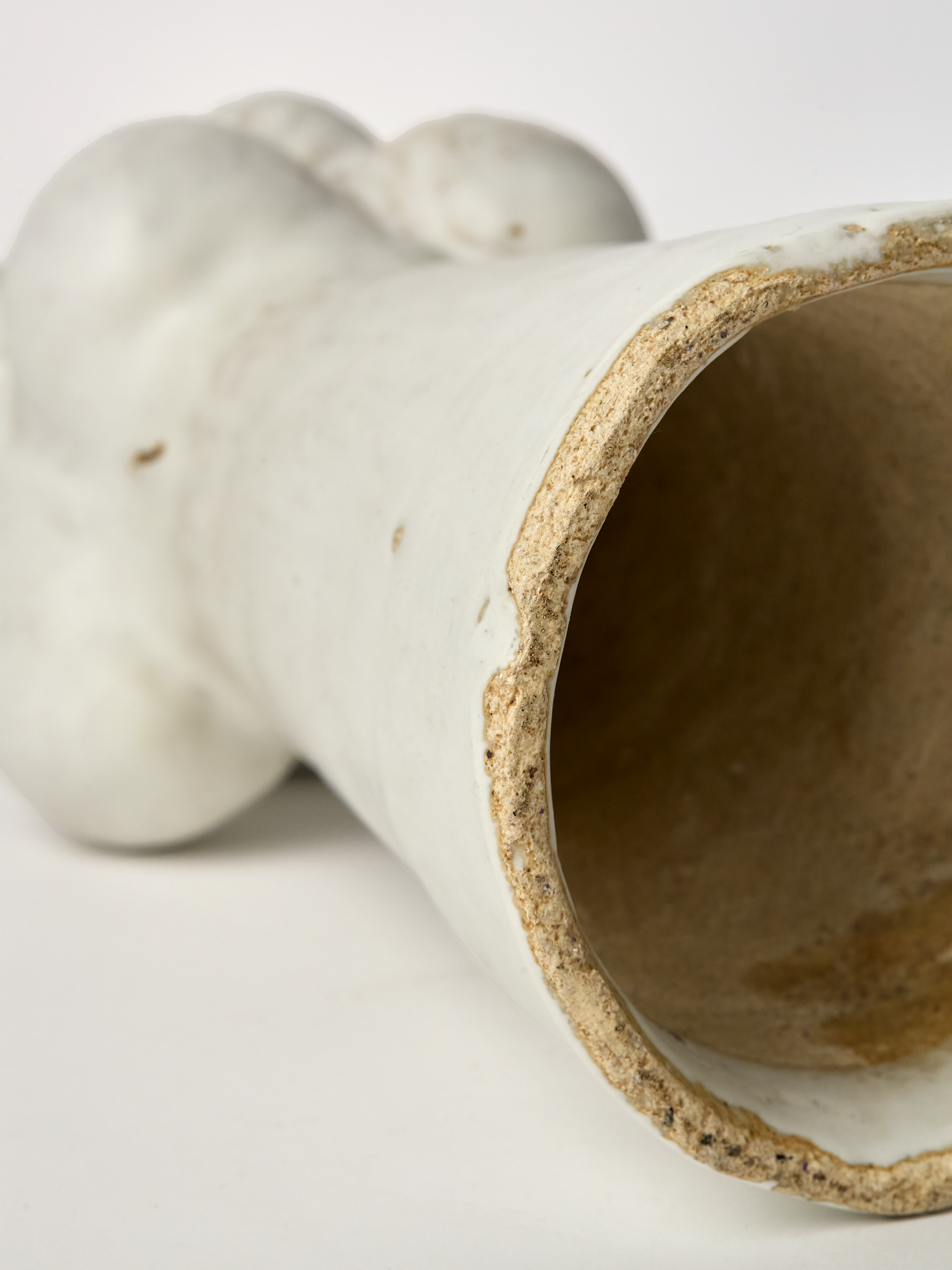 Close up of a Large  Pascale Vaquette ceramic matte glaze Cloud  Sculpture on a white background showing hollow interior.