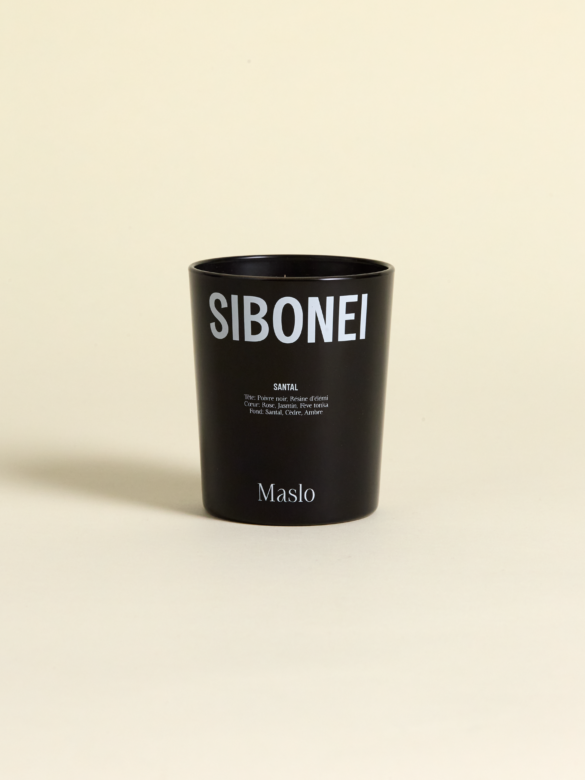 Sibonei santal "maslo" candle on light background