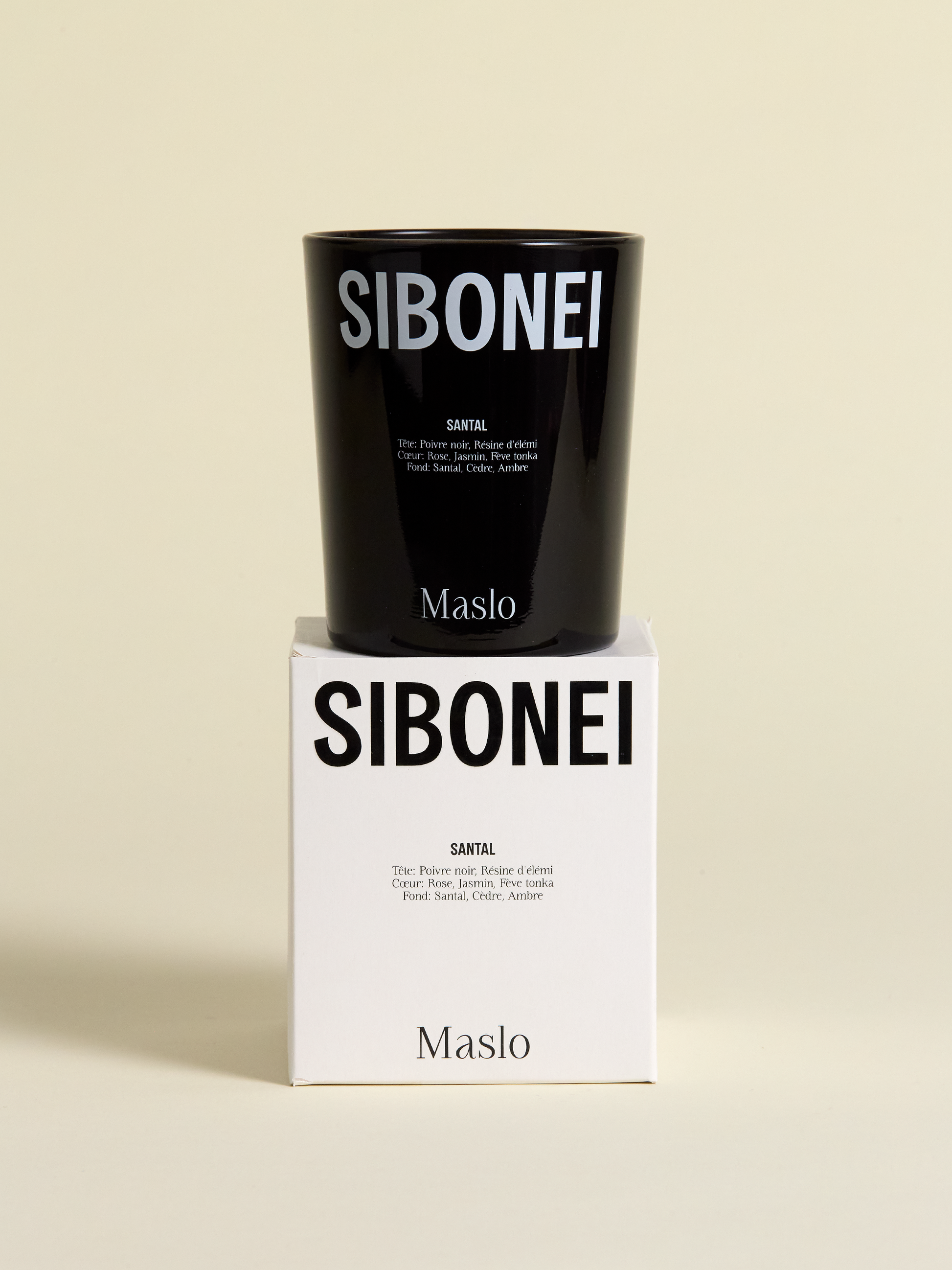 Sibonei santal "maslo" candle on top of candle box 