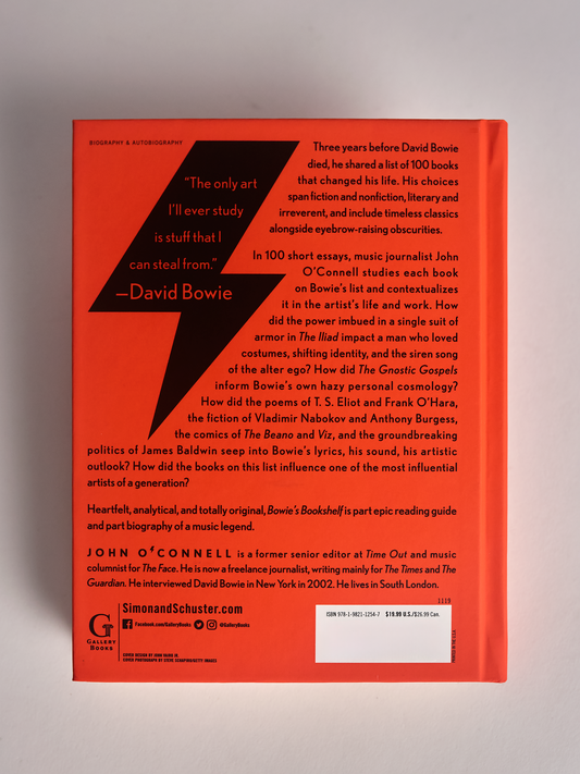 Orange Bowie's Bookshelf hard cover book back cover on grey background